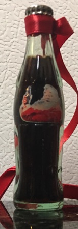 M06003-11 € 8,00 ccoa cola mini flesje kerstman (4x met doosje € 10,00)